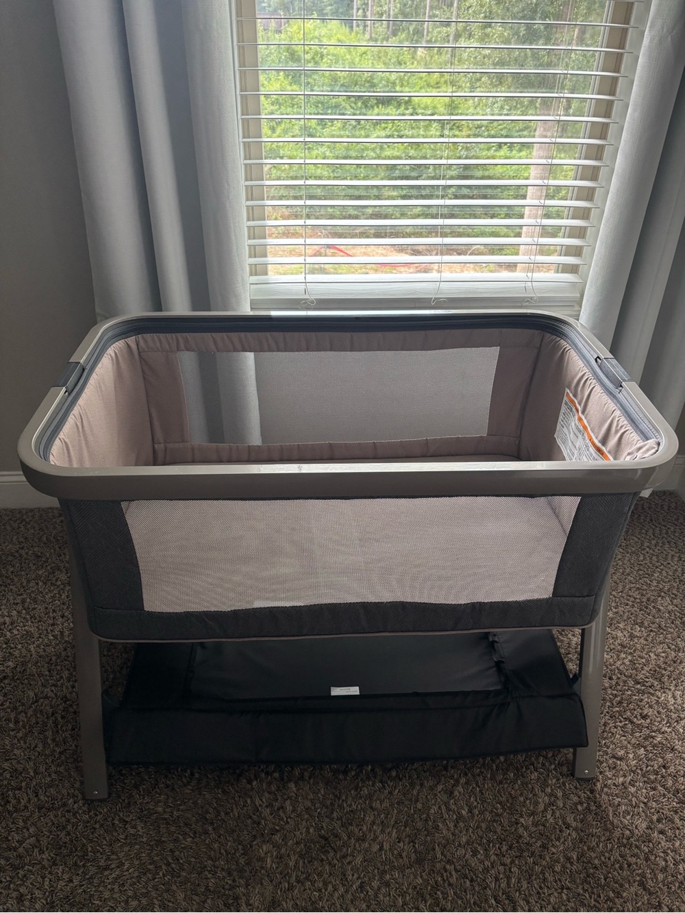 Portable Pink and Gray Bassinet with Storage Shelf